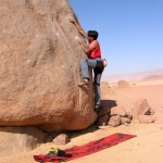 Mohammed Hammad on the granite boulders in front of Wadi Rum Horses stable.